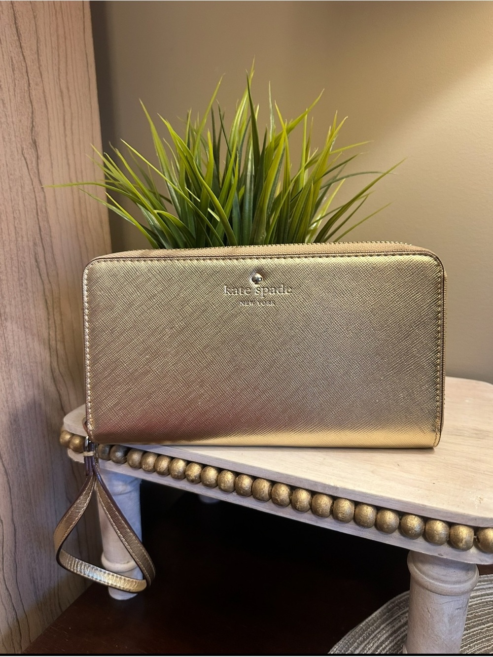 kate spade gold zip-around wristlet wallet